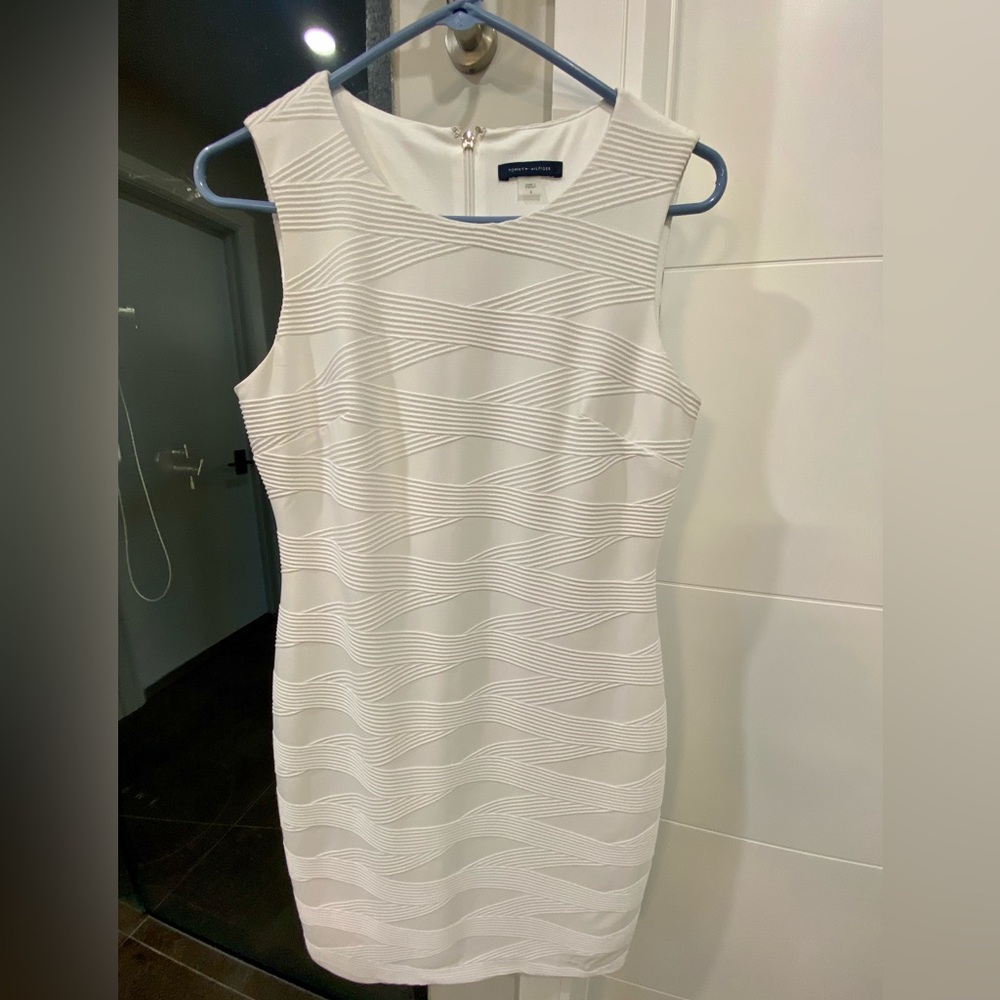 Tommy Hilfiger lined sheath dress with back zipper/hook and eye enclosure.
